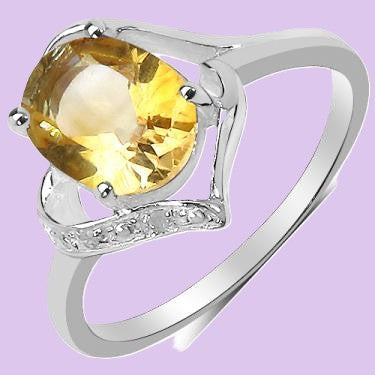A Single Citrine and Diamond size 7 Ring set in 14k White Gold Plated Sterling Silver